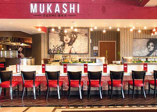 At Mukashi  at Resorts  International  Casino, the sushi bar is customer facing and colorful to match the dishes.