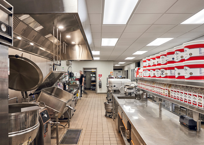 The catering hot food production area contains a 6-burner range, steamers, convection ovens and combis.