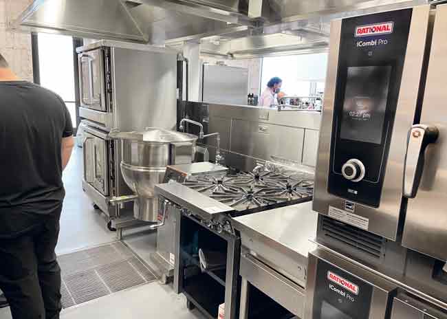 Convection ovens,  combi ovens, a tilt skillet and a range support larger-quantity production and catering. Photo by Nahum Goldberg