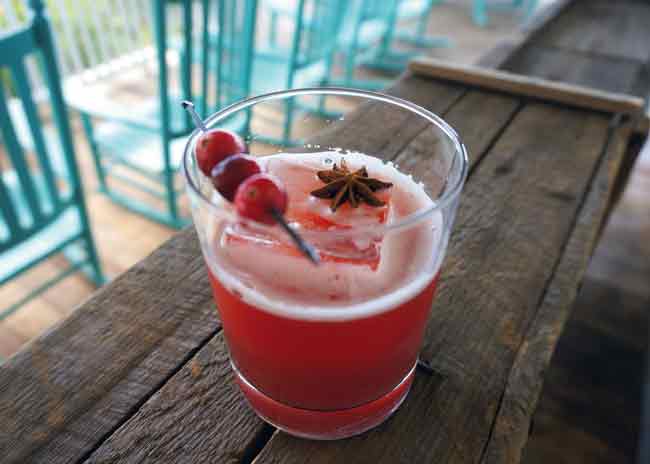 Fall-inspired cocktails by the Cocktail Guru: Fall Punch made with rum, cranberry puree, spiced cinnamon drink.