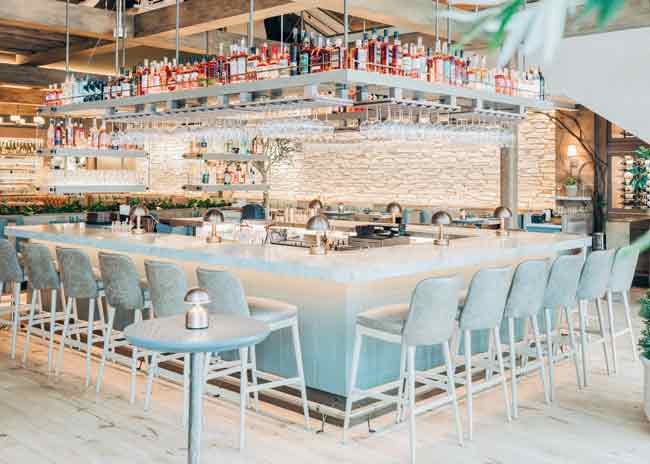 The open, airy design of both  the bar and  restaurant at  The Oakville Grill & Cellar in Chicago was inspired by Northern  California’s relaxed ambience and wine country. Photo courtesy of Lettuce Entertain You Restaurants