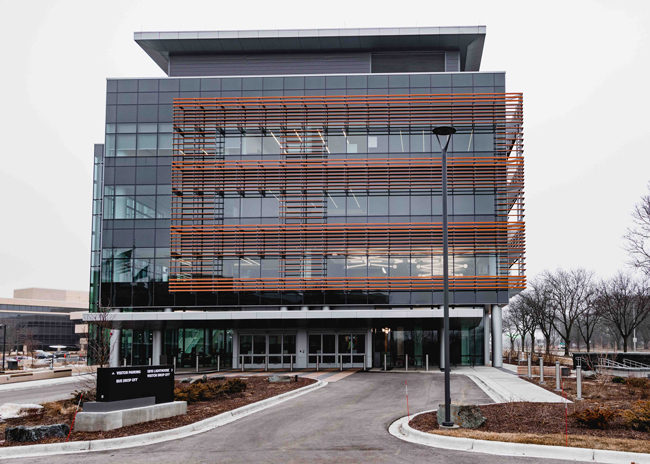 The Lighthouse building allows in natural light throughout, which accentuates the glass, chrome and artwork.