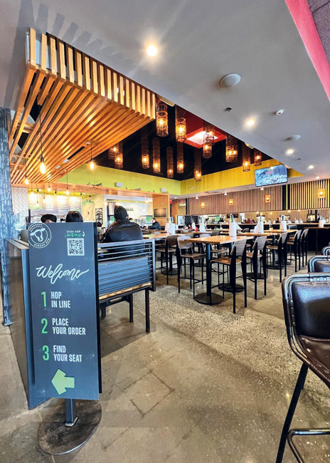 Hopdoddy locations feature a full bar and natural finishes.