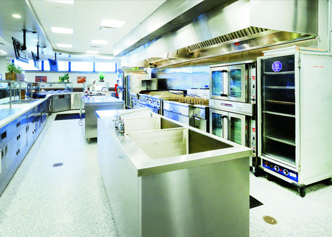 Equipment placement allows staff easy access to hot and cold menu item preparation, as well as sinks and front-of-the-house service.