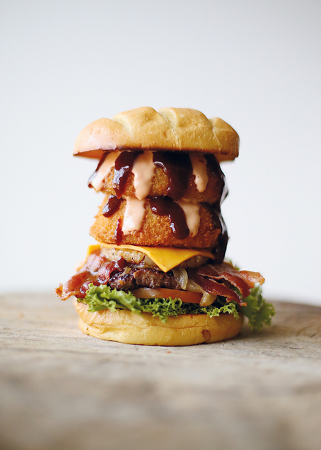 Seven Brothers’ signature burger is Shez’s Paniolo, topped with house-made onion rings, grilled pineapple, American cheese and barbecue sauce.