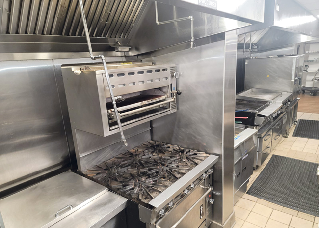 A hot line contains a range, a salamander, fryers, a charbroiler, a flattop griddle, a convection oven and a combi oven.  Photo by Ignazio Podda