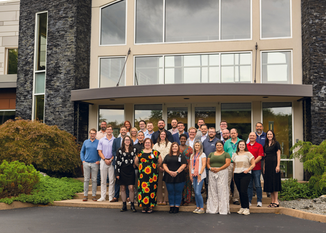 Members of KaTom’s strategic accounts and priority accounts teams outside the company’s corporate headquarters in Kodak, Tenn.