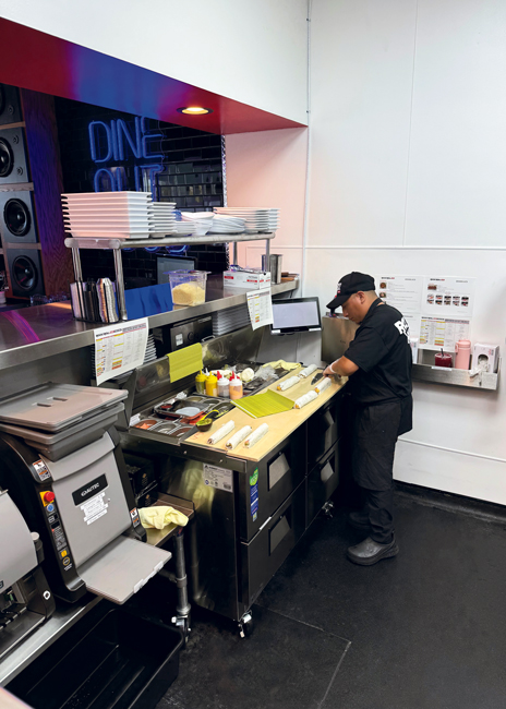 The sushi station utilizes a countertop rice sheeter, which helps with consistency and reduces the need for skilled sushi chefs.