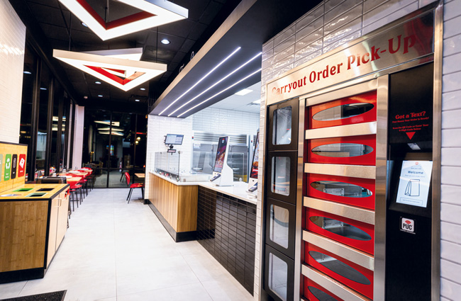 Pizza Hut’s latest prototype includes self-service kiosks and cabinets for contactless pickup. The chain also plans to introduce drive-thrus with a ready-now menu.