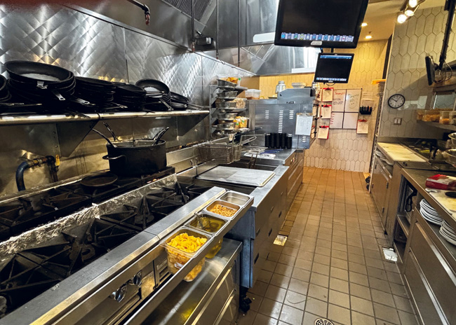 The two-level range on the hot line is used for pasta dishes and for eggs at weekend brunch.