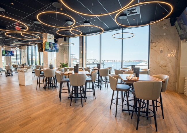 The Boston Moxies is located in the city’s seaport area. The restaurant’s design takes advantage of the view.