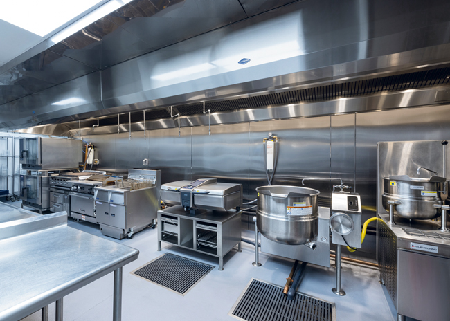 Staff use combis and fryers, as well as a charbroiler, a plancha, a skillet, and a tilting kettle to prepare menu items for most dining locations.