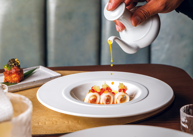 On the ground floor of one of the country’s top grossing steakhouses, Maple & Ash, Eight Bar offers Japanese-inspired dishes on its golden omakase menu, including Hiramasa crudo with spicy citrus ponzu sauce. Photo courtesy of MADN Agency