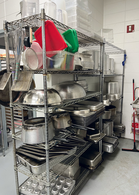 Pots and pans stay organized on wire shelving.