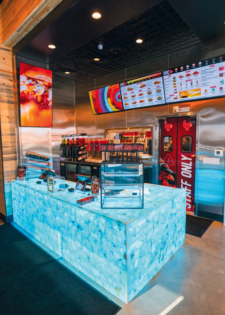 The POS counter is made of a quartz-like material and lit from below with color-changing LEDs.