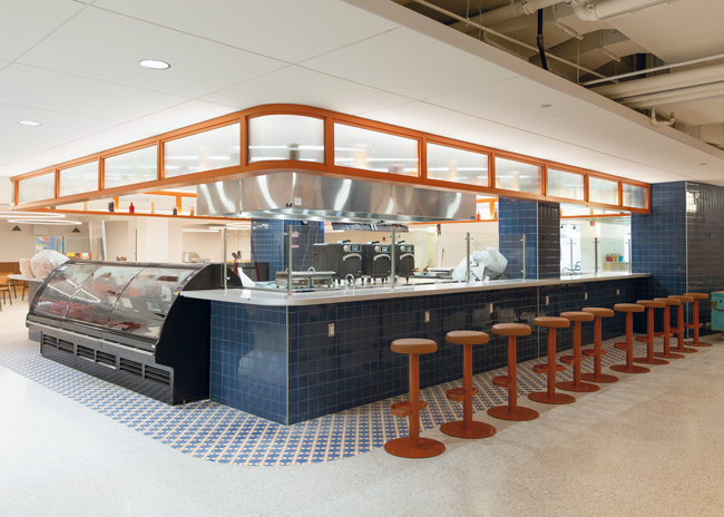 Guests can sit on high-top stools at the Briny Pickle counter to watch the culinary team make the menu items. A deli case also offers pasta and cucumber salads and sandwiches.