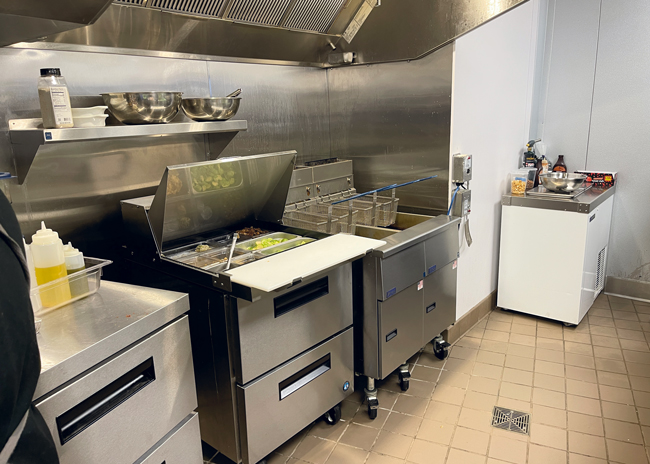 A fryer and  refrigerated rail support production.