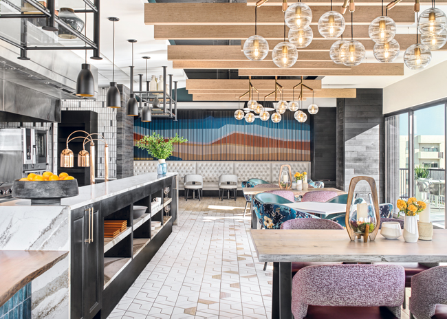 A major remodel for Friendship Village in Tempe, Ariz., included a full-service restaurant with an open grill line, a semi-formal dining room with a focus on seasonal and local ingredients, and facilities for cooking classes and wine tastings. The bar opens up to the roof and features a tapas menu. Photo courtesy of SCOPOS Hospitality Group; photo by Alise O’Brien