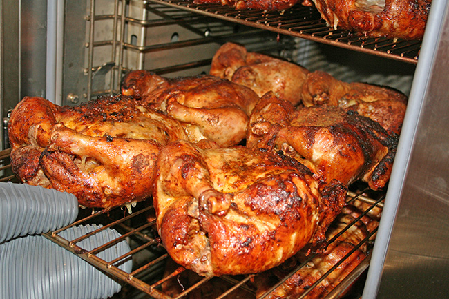 SRG-400 stationary rack gas smoker filled with smoked chickens
