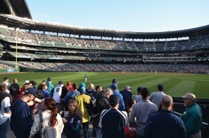 The ’Pen patio at Safeco Field allows fans to watch the game while ordering and eating food.