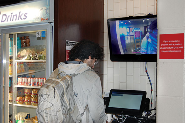 Bama Bus Hub kiosk crop in to take out phone 