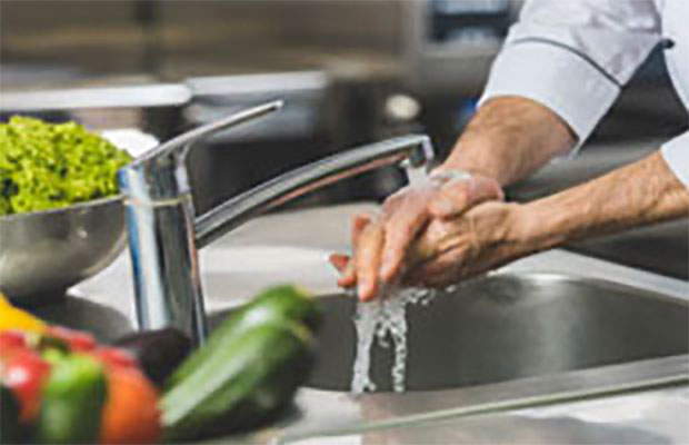 Chef washing hands before preparing food